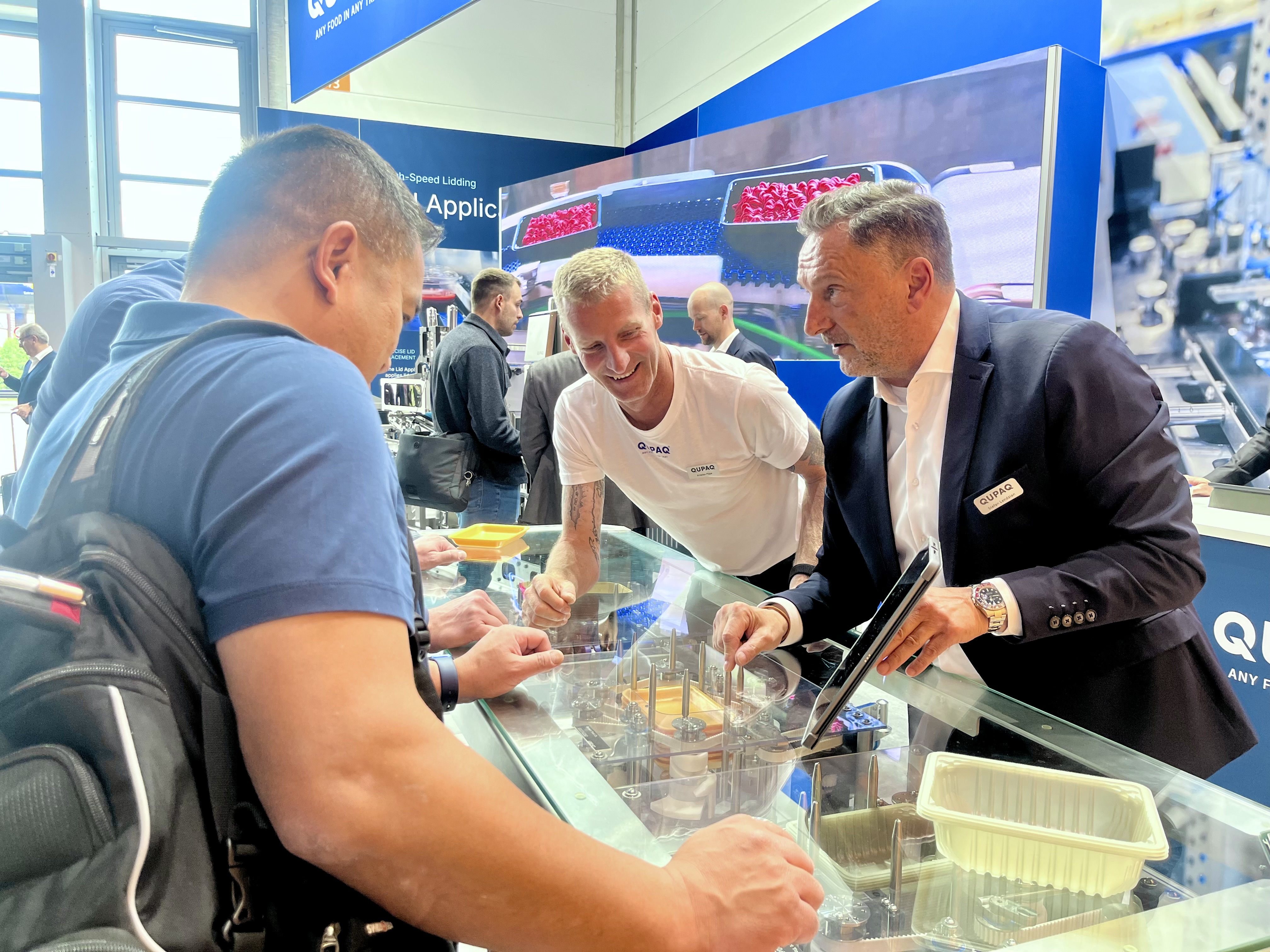 Sales and Technical Team from QUPAQ making a presentation to a customer at Interpack 2026