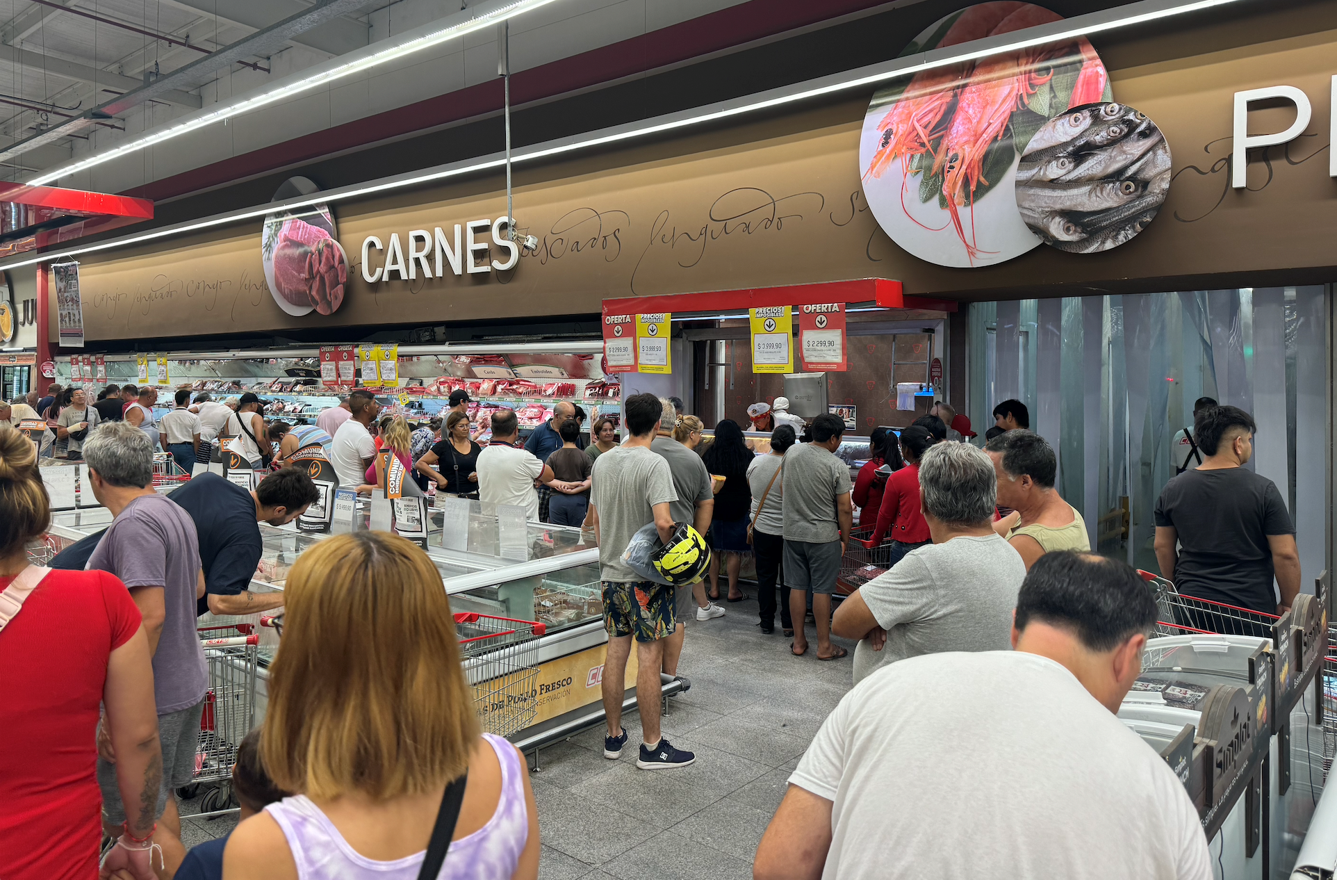 In a COTO store in Escobar on a typical Sunday, where people are waiting in line to get the meat for their Sunday asado.