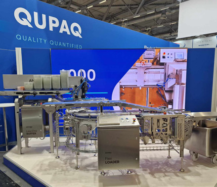 Our main attraction at ANUGA FoodTec was our newest innovation and addition to our product portfolio: The QUPAQ Flex Loader, which we believe meets all the criteria of what a flexible solution should be.  Being able to gather more than 100 people for a product launch on the first day of the fair is something we take pride in – and didn’t even have to set a world record to do it. With music, visual effects, and live demonstrations we believe the QUPAQ Flex Loader was introduced in the perfect setting possible.  To flex our muscles live, we did three different use cases on stage for the demonstrations, including:  1: Minced portions loaded in single-load mode  2: Patties loaded in single rows in step-load mode  3: Sliced steaks stacked in staggered layers in step-load mode